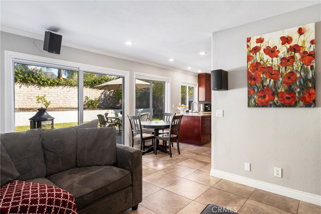 25671 Westover Circle Lake Forest, CA 92630 - Photo 11 of 37 a living room with furniture and a floor to ceiling window