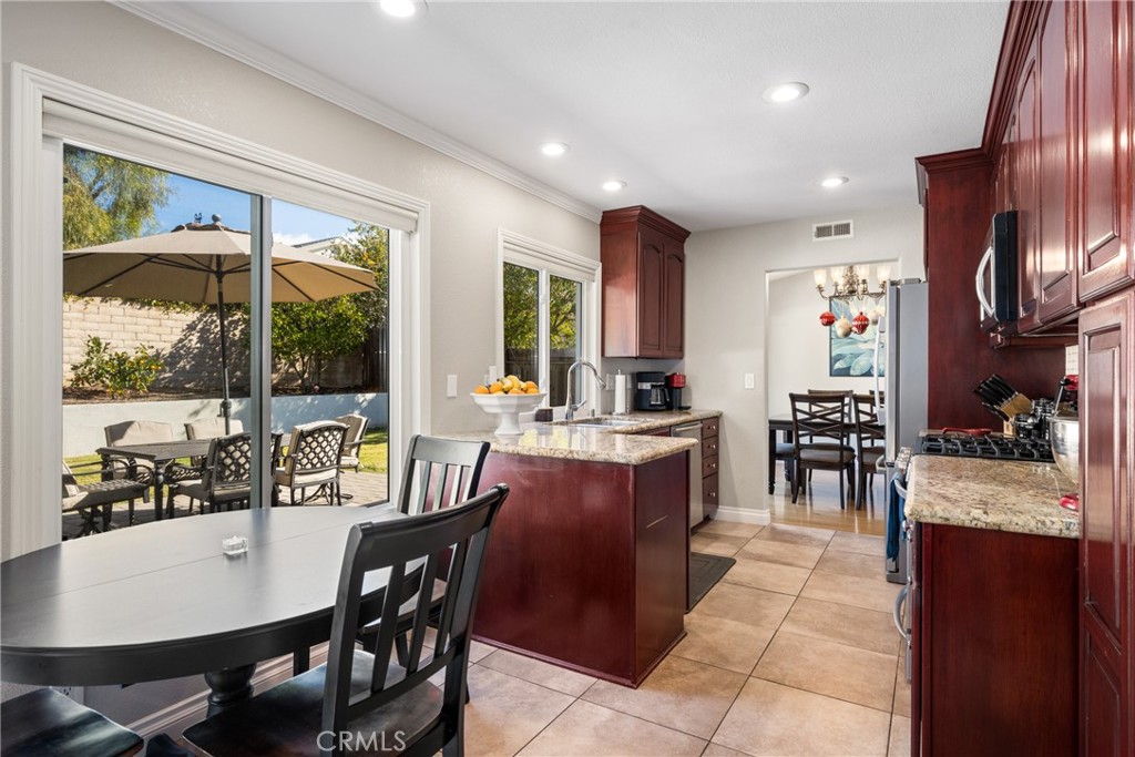 25671 Westover Circle Lake Forest, CA 92630 - Photo 14 of 37 a view of a dining room with furniture window and outside view