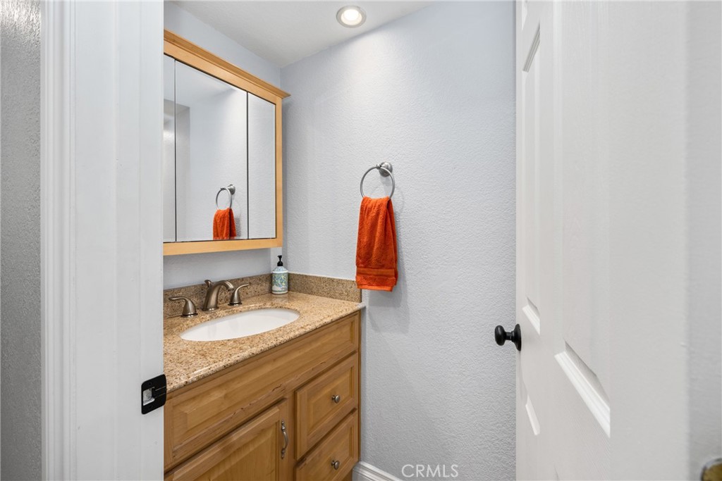 25671 Westover Circle Lake Forest, CA 92630 - Photo 20 of 37 a bathroom with a sink vanity and a mirror