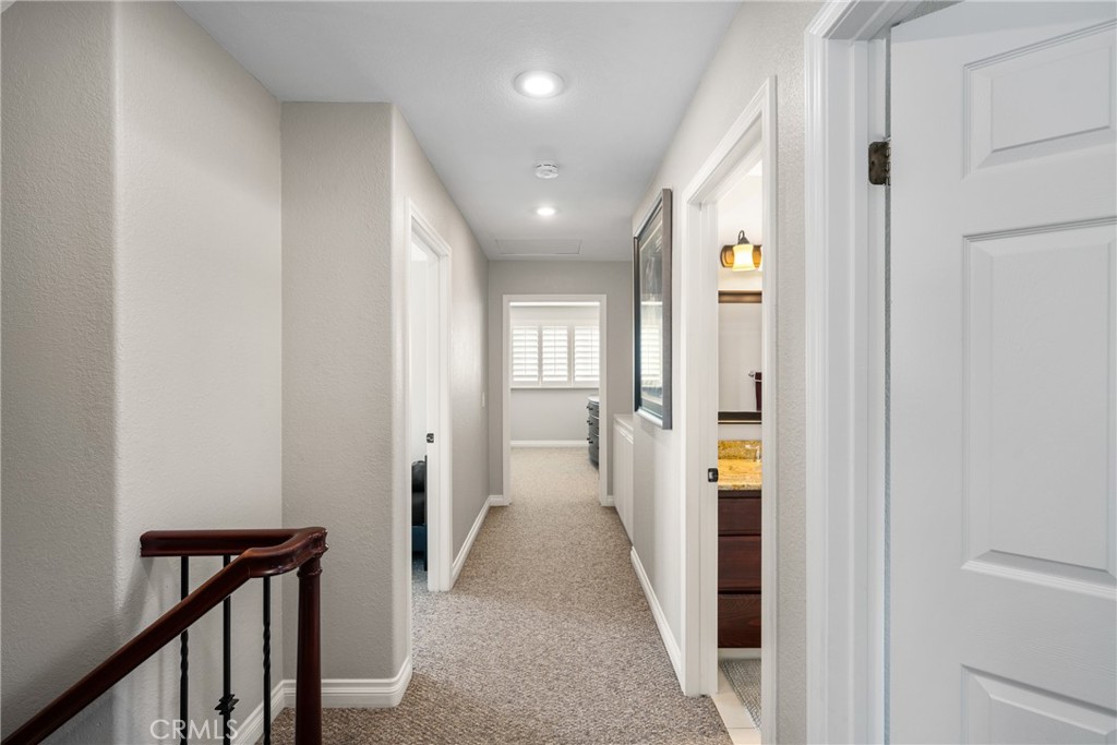 25671 Westover Circle Lake Forest, CA 92630 - Photo 21 of 37 a view of hallway with wooden floor and stairs