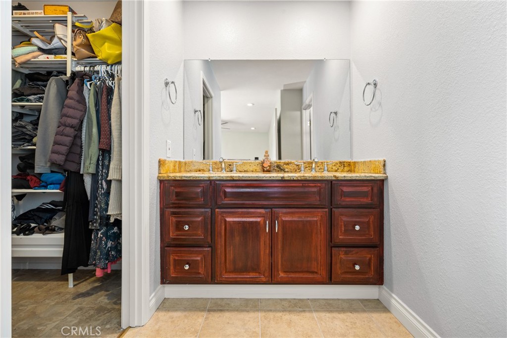 25671 Westover Circle Lake Forest, CA 92630 - Photo 25 of 37 a bathroom with a sink and a mirror