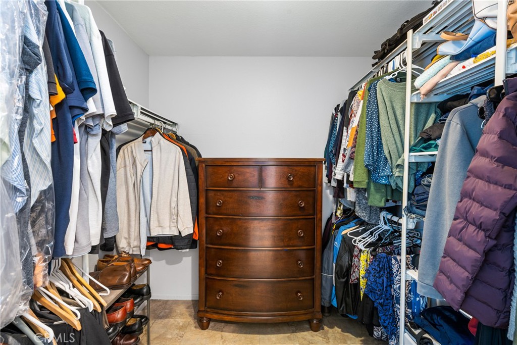 25671 Westover Circle Lake Forest, CA 92630 - Photo 26 of 37 a view of walk in closet with clothes