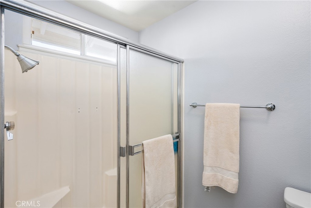 25671 Westover Circle Lake Forest, CA 92630 - Photo 27 of 37 a bathroom with a shower and a toilet