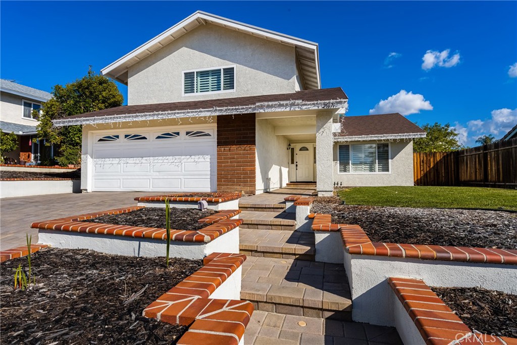 25671 Westover Circle Lake Forest, CA 92630 - Photo 3 of 37 a front view of house with yard