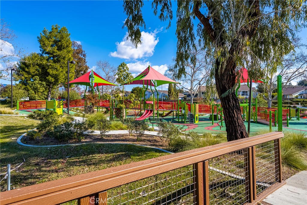 25671 Westover Circle Lake Forest, CA 92630 - Photo 34 of 37 a view of a pathway of a house with a yard and large trees