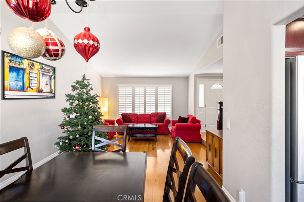 25671 Westover Circle Lake Forest, CA 92630 - Photo 7 of 37 a bedroom with furniture and a potted plant