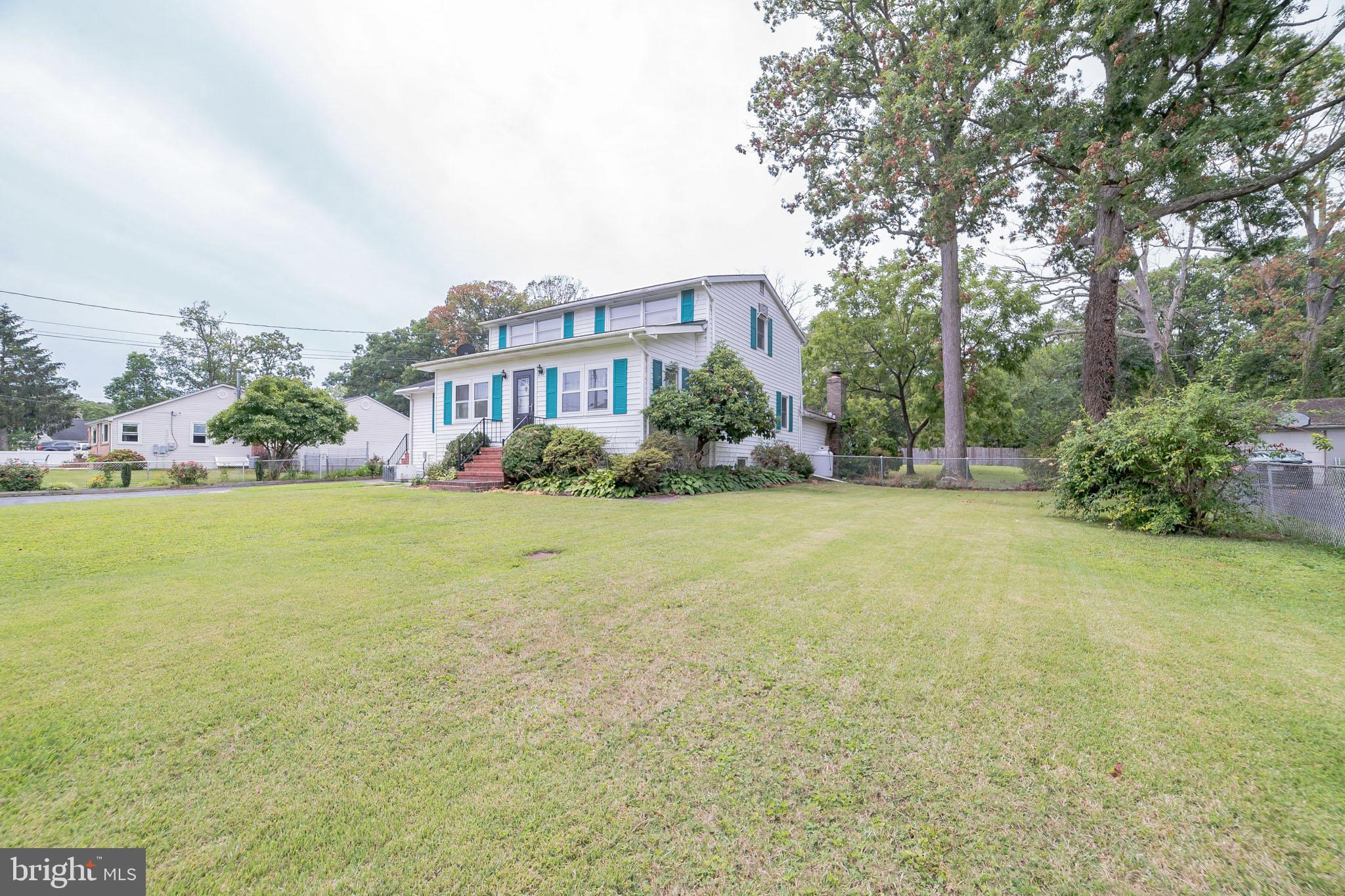 612 Carvel Grove Road Baltimore, MD 21221 - Photo 2 of 21 a front view of house with yard and trees in the background