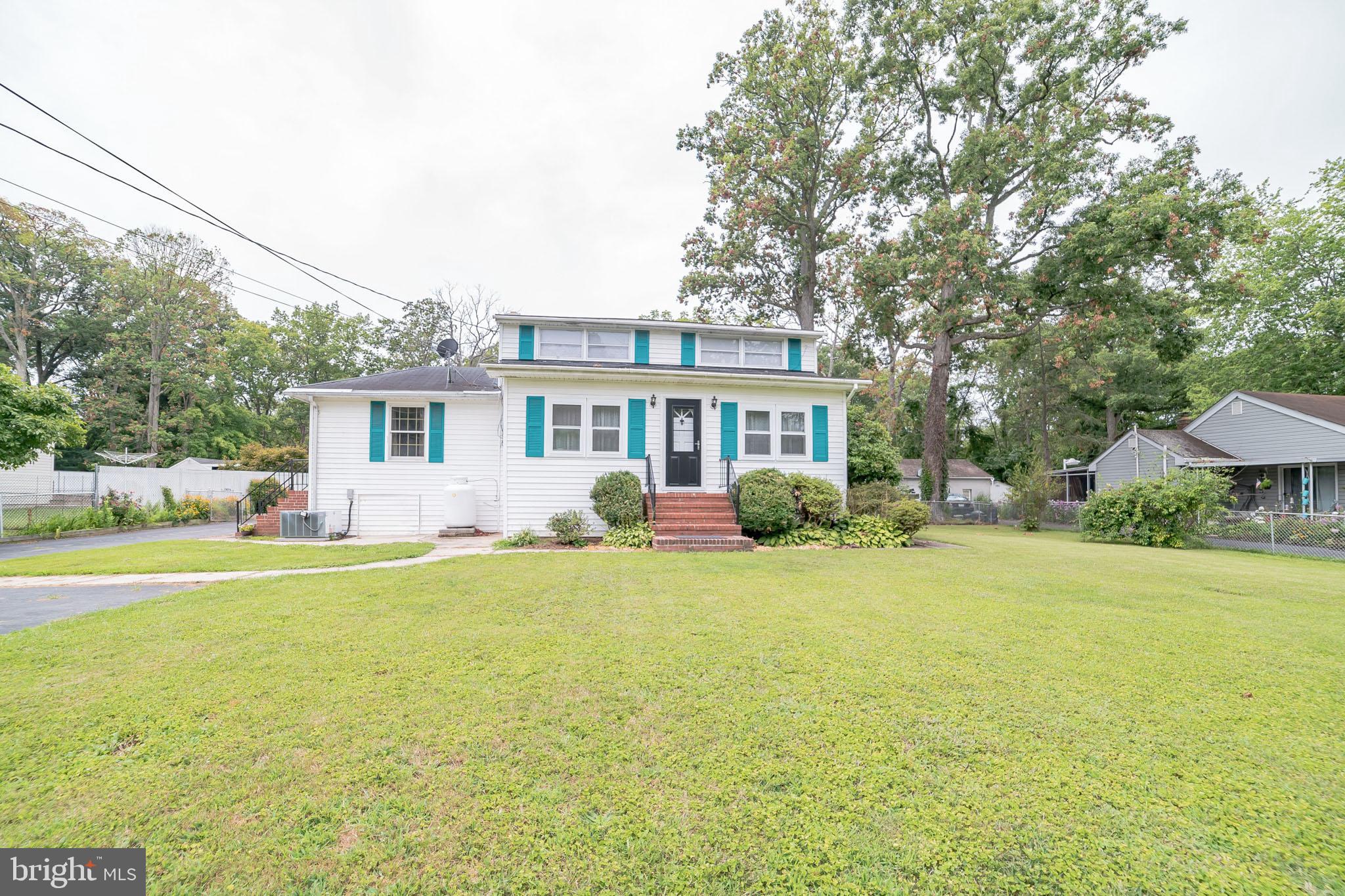 612 Carvel Grove Road Baltimore, MD 21221 - Photo 14 of 21 a view of a house with a big yard and potted plants