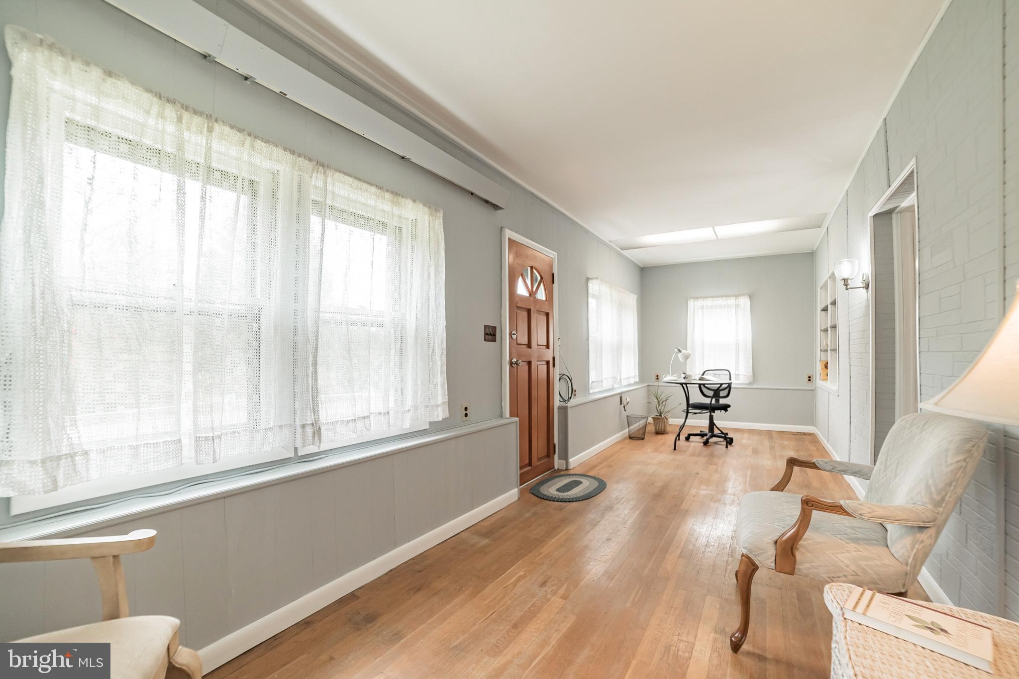 612 Carvel Grove Road Baltimore, MD 21221 - Photo 9 of 21 a view of a livingroom with wooden floor and furniture