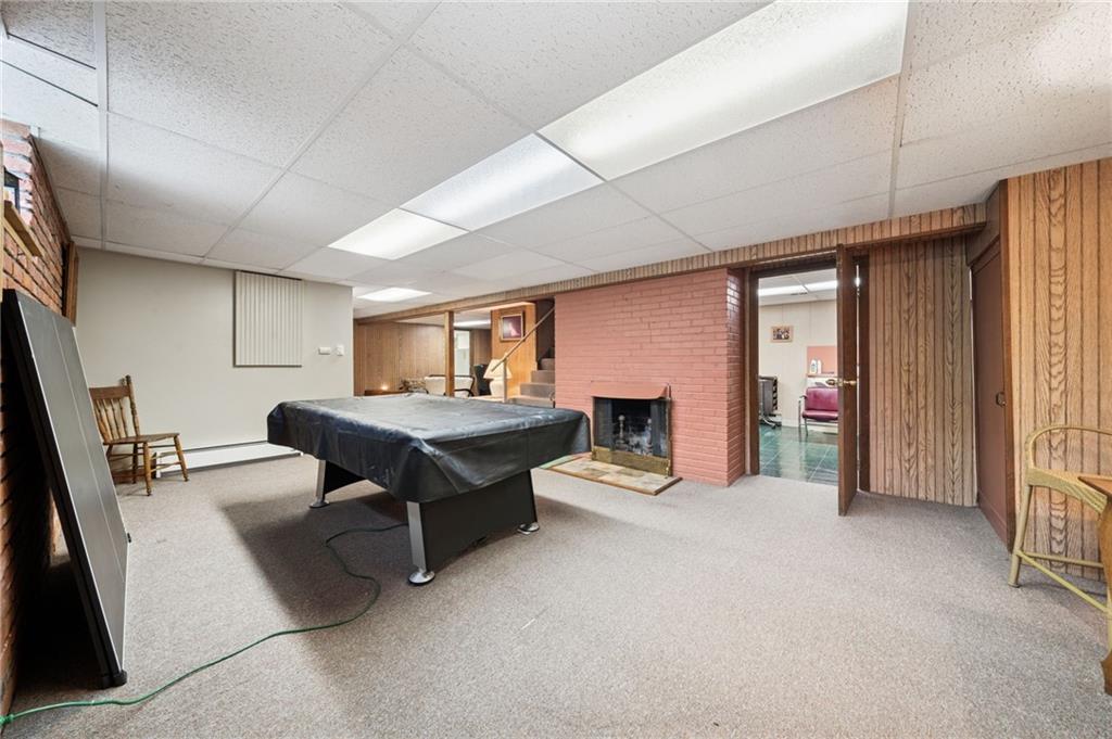 353 Linnwood Road Eighty Four, PA 15330 - Photo 23 of 36 a living room with furniture flat screen tv and a fireplace