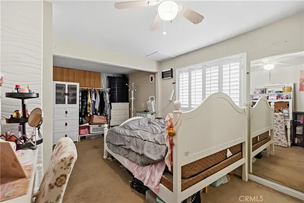 a bed room with bed and window
