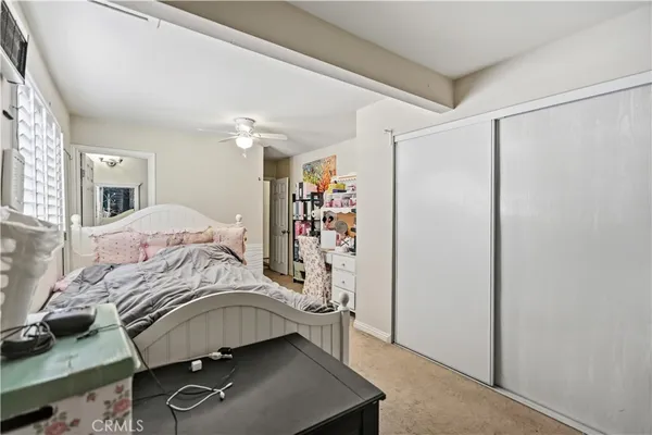 a bedroom with a bed and a dresser