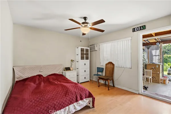 a bedroom with a bed and a chair