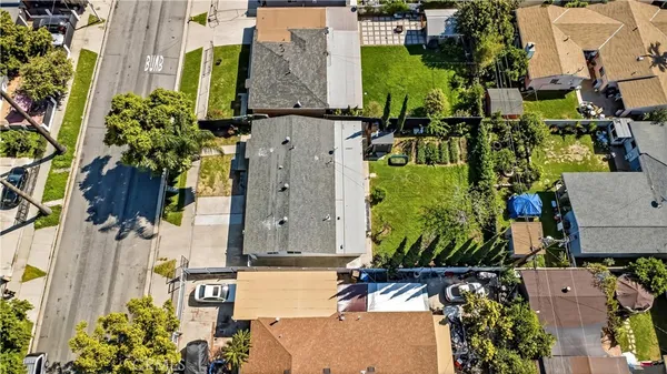 an aerial view of houses with outdoor space