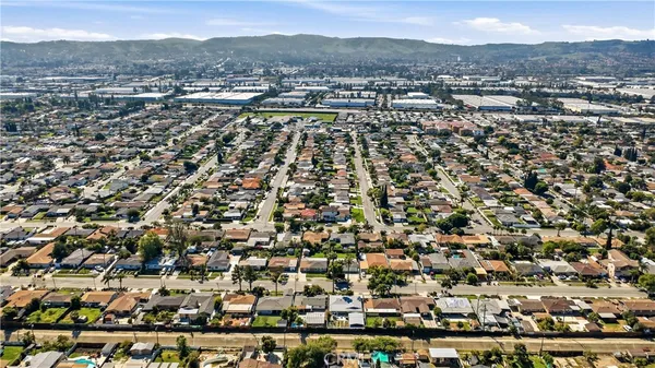 an aerial view of residential houses with outdoor space