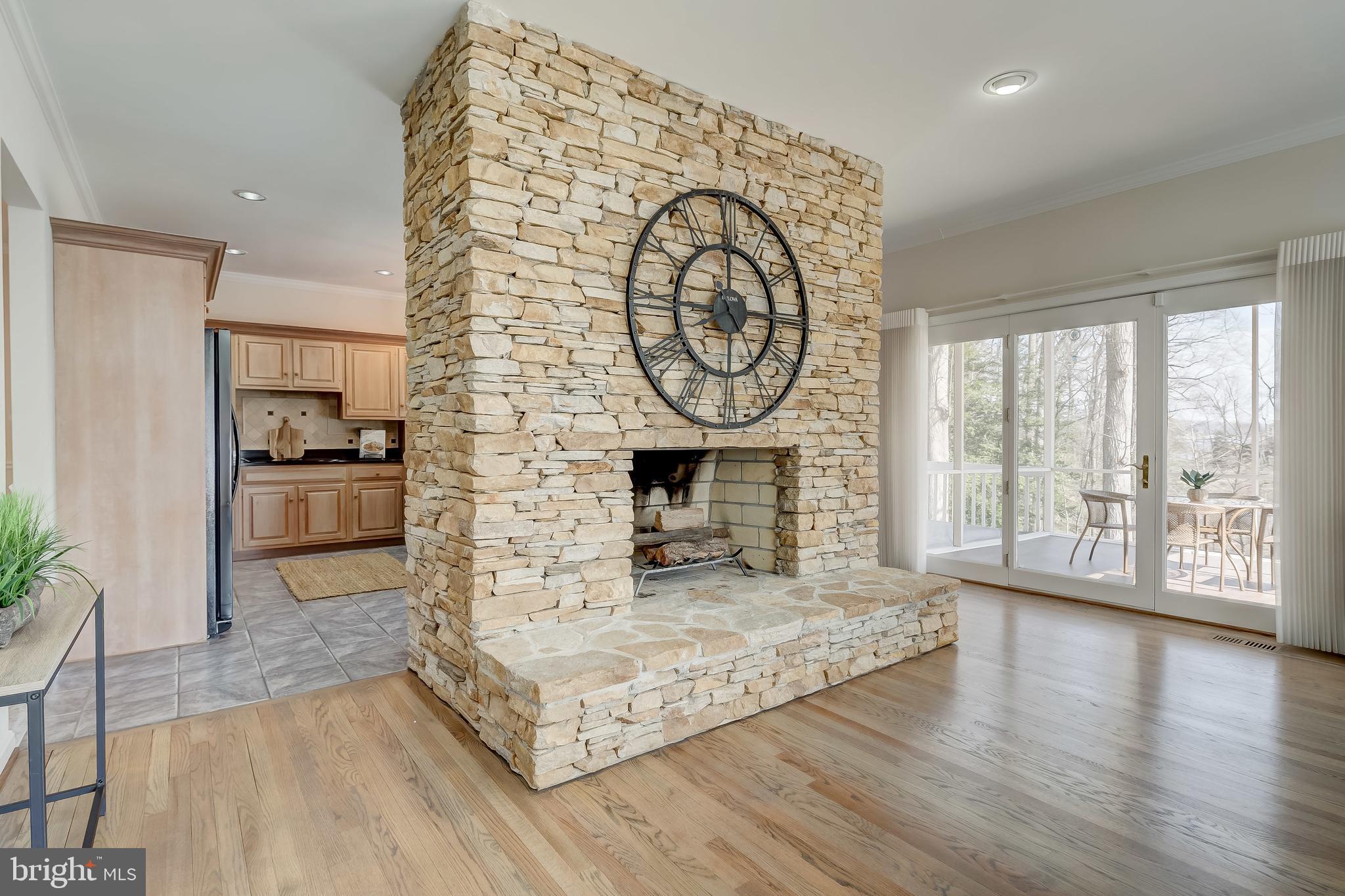 380 South River Landing Road Edgewater, MD 21037 - Photo 9 of 70 Stacked stone fireplace is a beautiful focal point