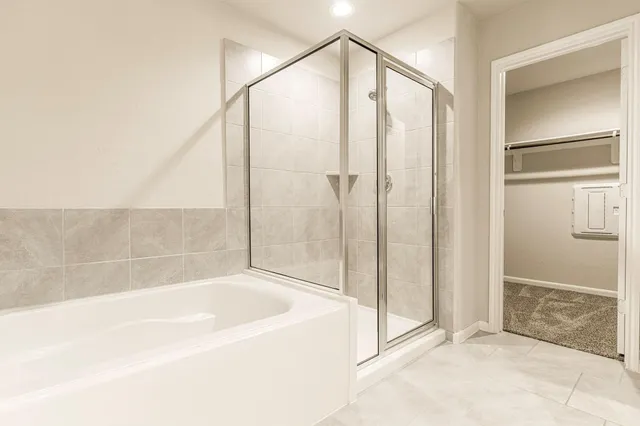 a bathroom with a bathtub and a shower