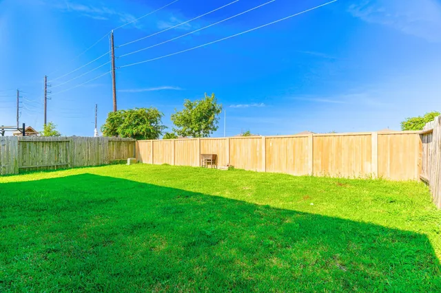 a view of a backyard with potted plants