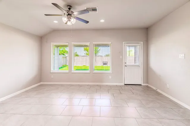 a view of an empty room with a window