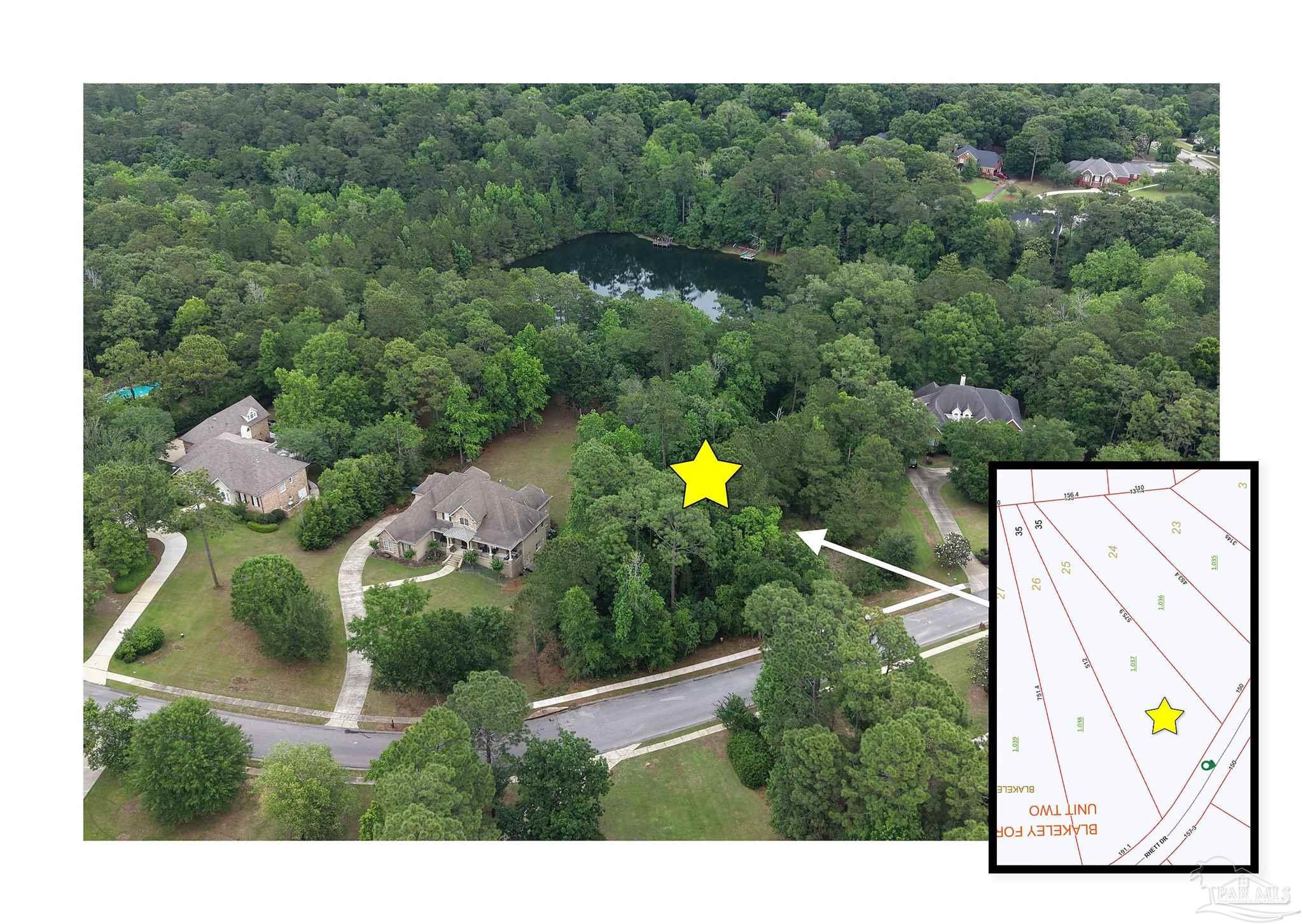 an aerial view of a house with a yard swimming pool