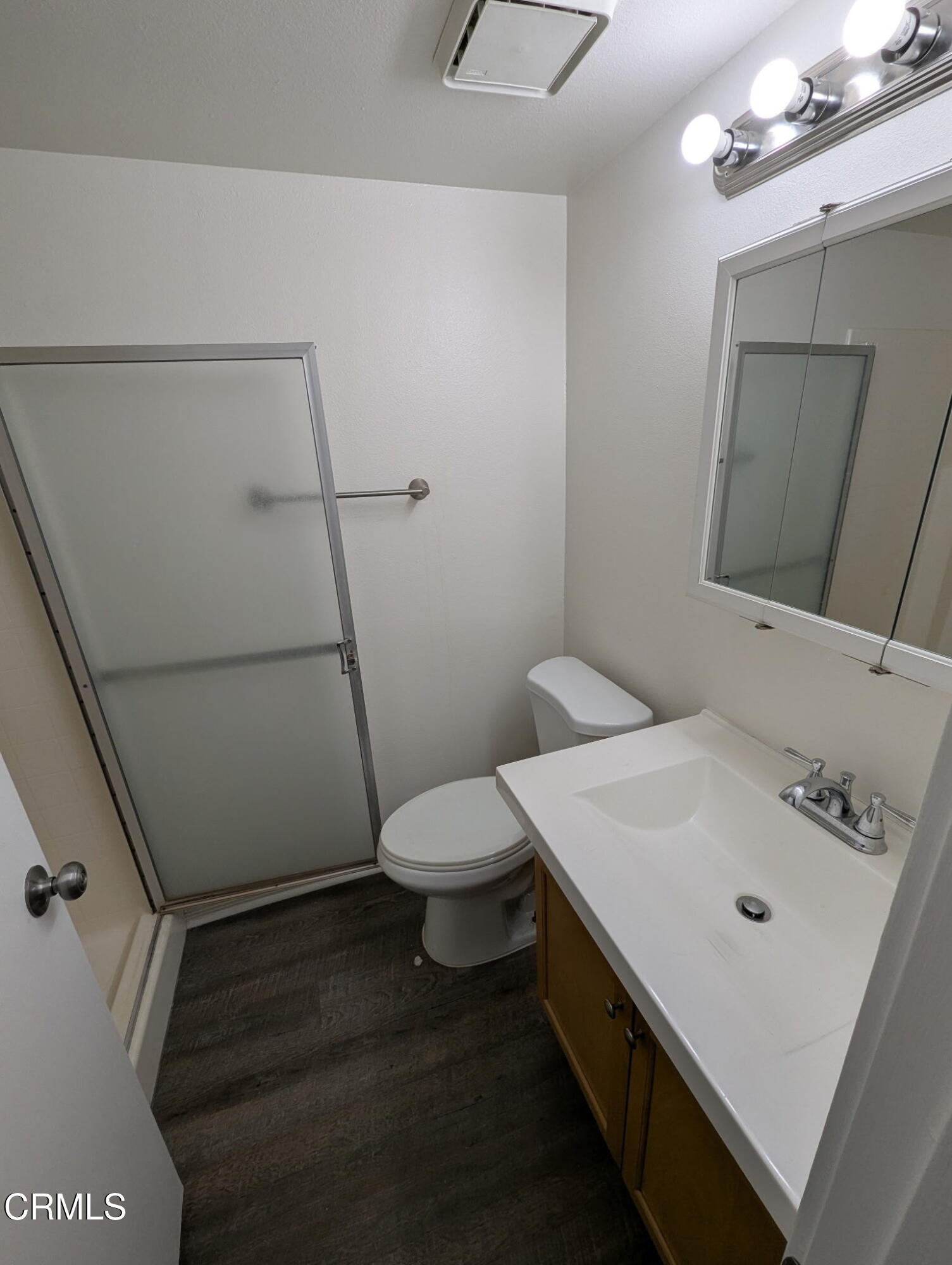 1851 Patricia Avenue, Unit 102 Simi Valley, CA 93065 - Photo 11 of 23 a bathroom with a sink a toilet and a mirror