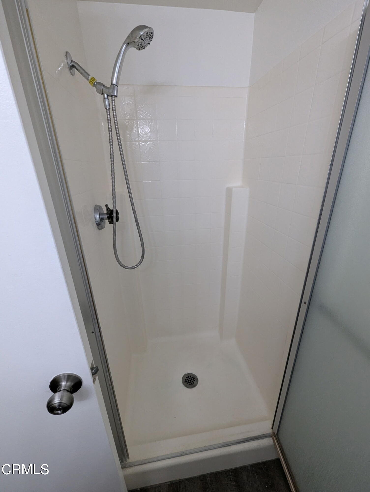 1851 Patricia Avenue, Unit 102 Simi Valley, CA 93065 - Photo 12 of 23 a bathroom with a glass door shower