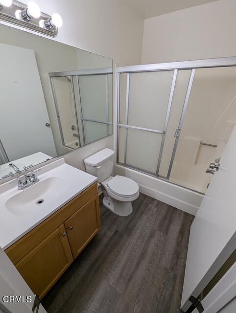 1851 Patricia Avenue, Unit 102 Simi Valley, CA 93065 - Photo 14 of 23 a bathroom with a sink a toilet a mirror and shower