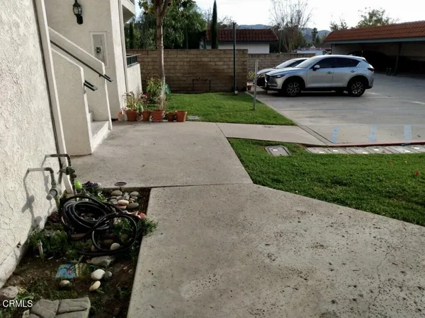 a view of street with parked cars