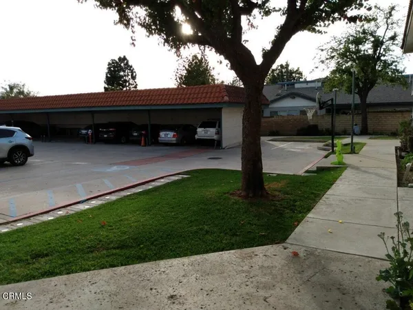 a view of a car park in front of a house