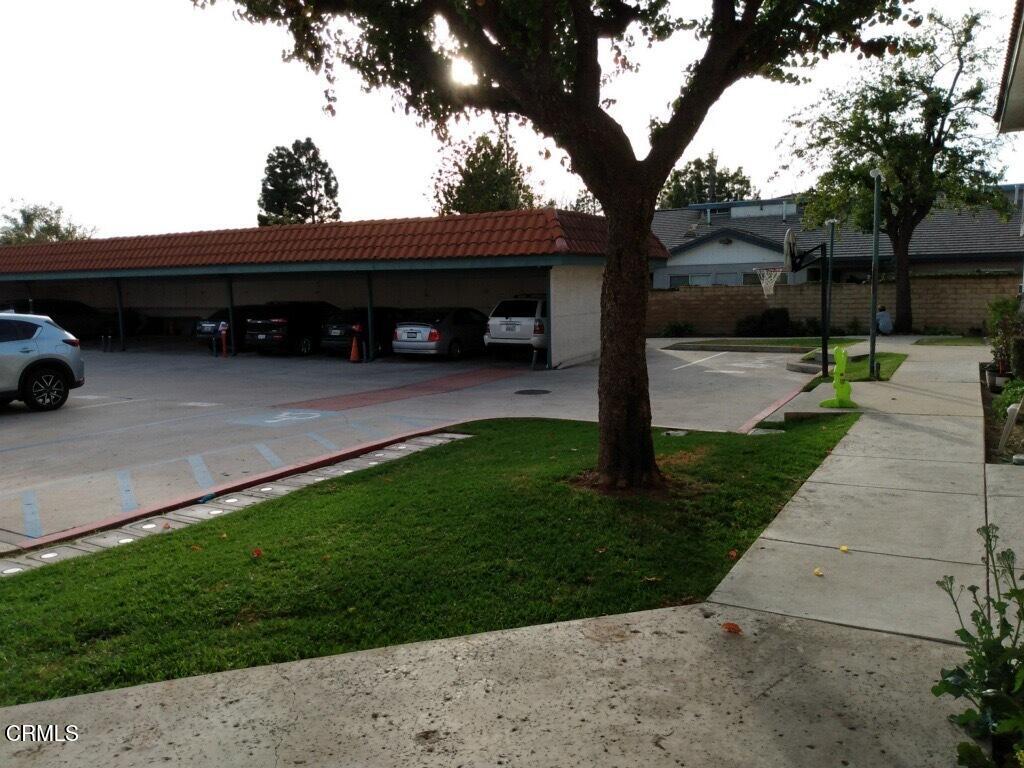 1851 Patricia Avenue, Unit 102 Simi Valley, CA 93065 - Photo 20 of 23 a view of a car park in front of a house