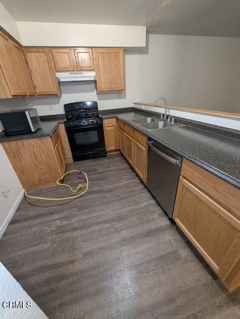 1851 Patricia Avenue, Unit 102 Simi Valley, CA 93065 - Photo 5 of 23 a kitchen with granite countertop a stove and a sink