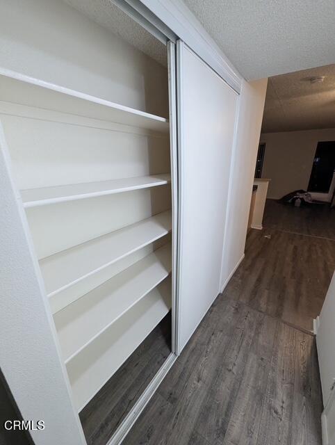 1851 Patricia Avenue, Unit 102 Simi Valley, CA 93065 - Photo 7 of 23 a view of walk in closet with empty racks