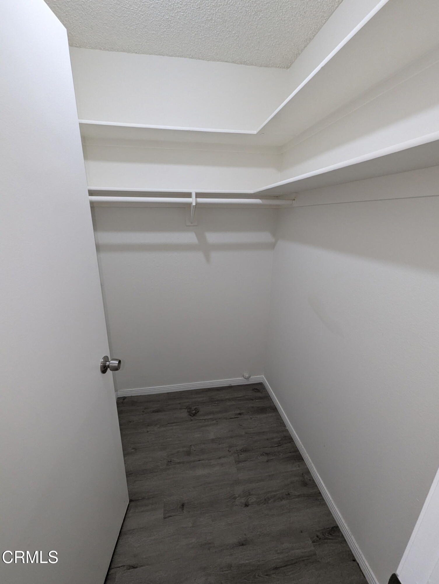 1851 Patricia Avenue, Unit 102 Simi Valley, CA 93065 - Photo 10 of 23 a view of a room with wooden floor