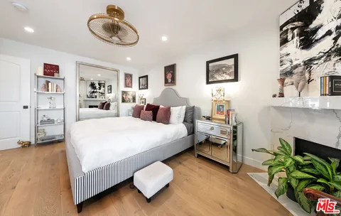 a bed room with a bed and a chandelier