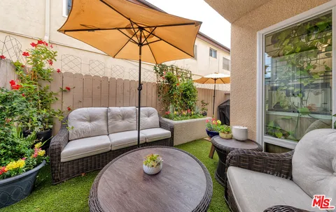 a outdoor living space with furniture and garden