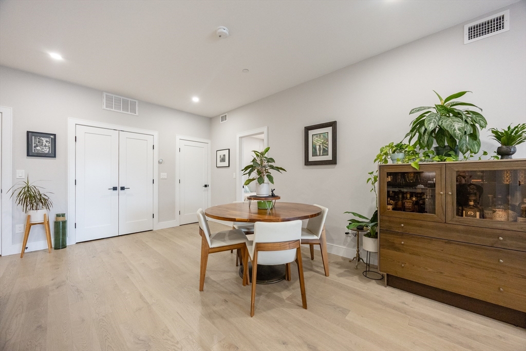 70 Shawsheen Road, Unit PH5 Boston, MA 02128 - Photo 13 of 42 a living room with furniture and a potted plant