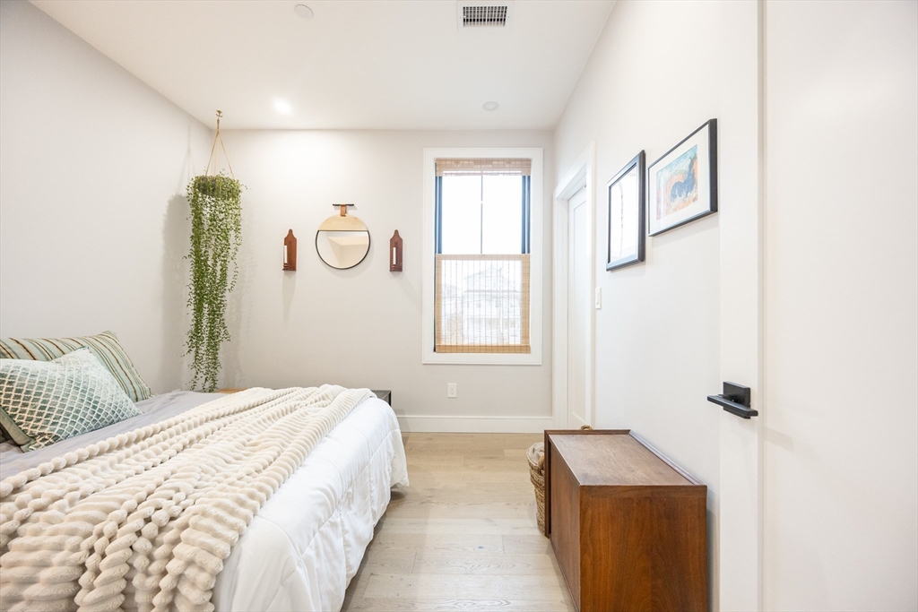 70 Shawsheen Road, Unit PH5 Boston, MA 02128 - Photo 23 of 42 a bedroom with a bed and a window