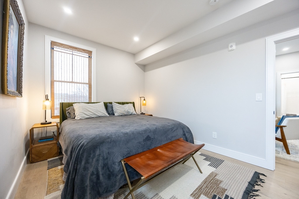 70 Shawsheen Road, Unit PH5 Boston, MA 02128 - Photo 28 of 42 a bed room with a bed and a window