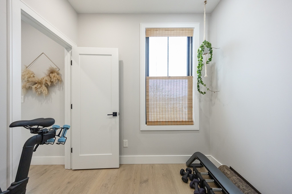 70 Shawsheen Road, Unit PH5 Boston, MA 02128 - Photo 32 of 42 a view of a room with gym equipment and a window