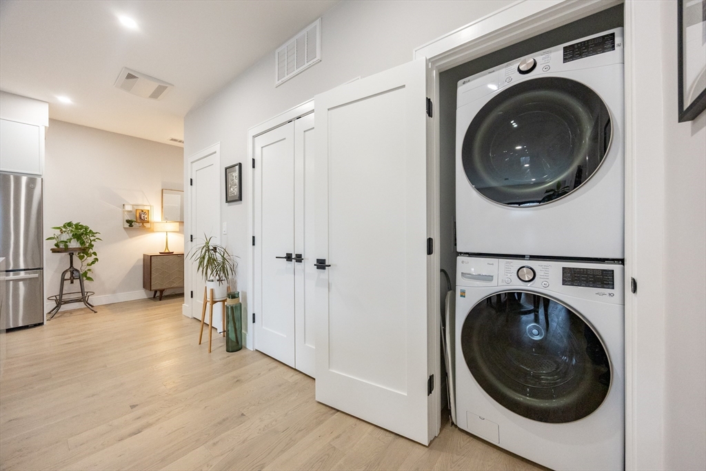 70 Shawsheen Road, Unit PH5 Boston, MA 02128 - Photo 36 of 42 a view of a hallway with washer and dryer