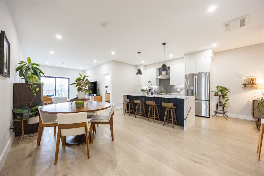 70 Shawsheen Road, Unit PH5 Boston, MA 02128 - Photo 10 of 42 a view of a dining room with furniture