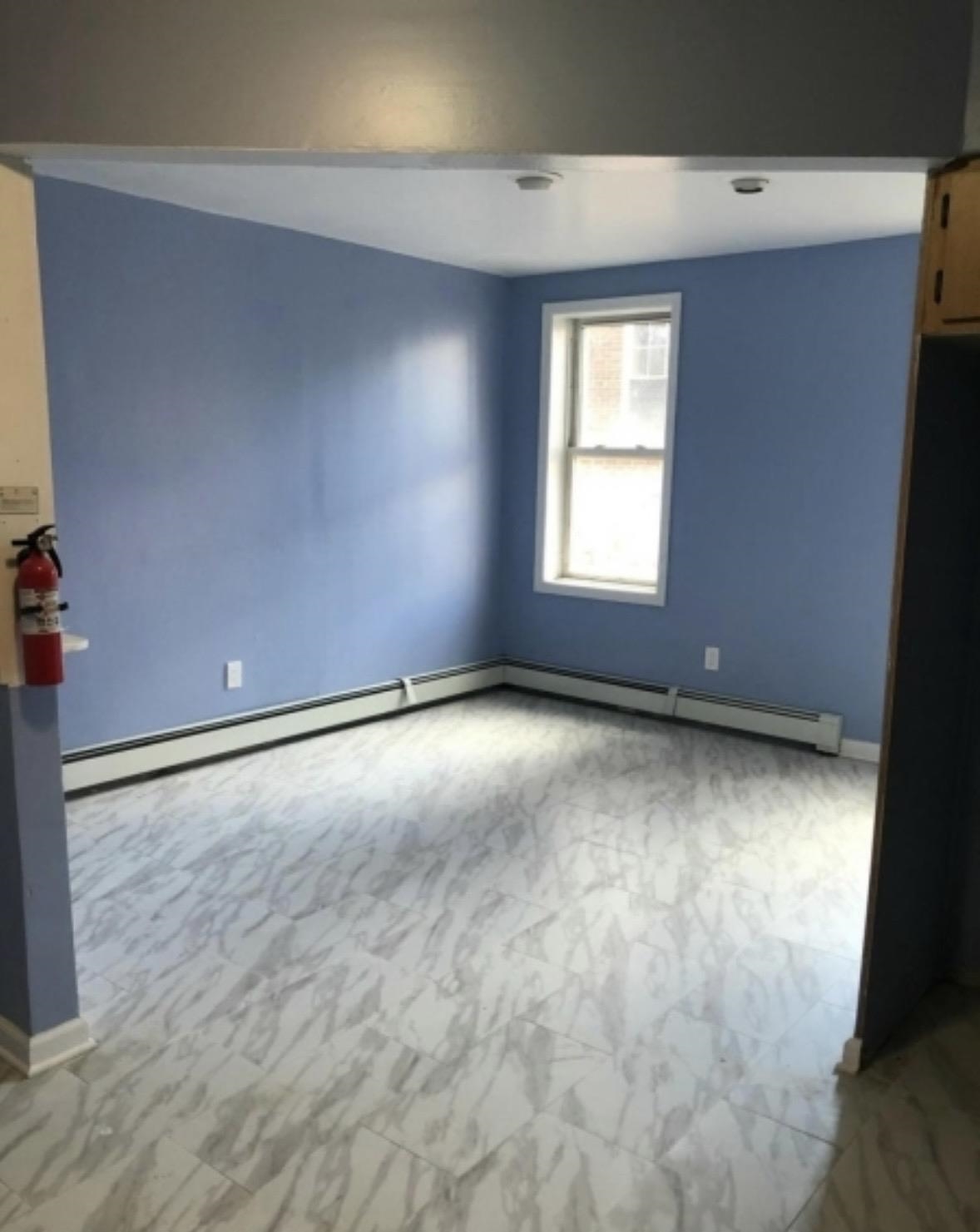 505 5th Street Union City, NJ 07087 - Photo 12 of 17 an empty room with a window