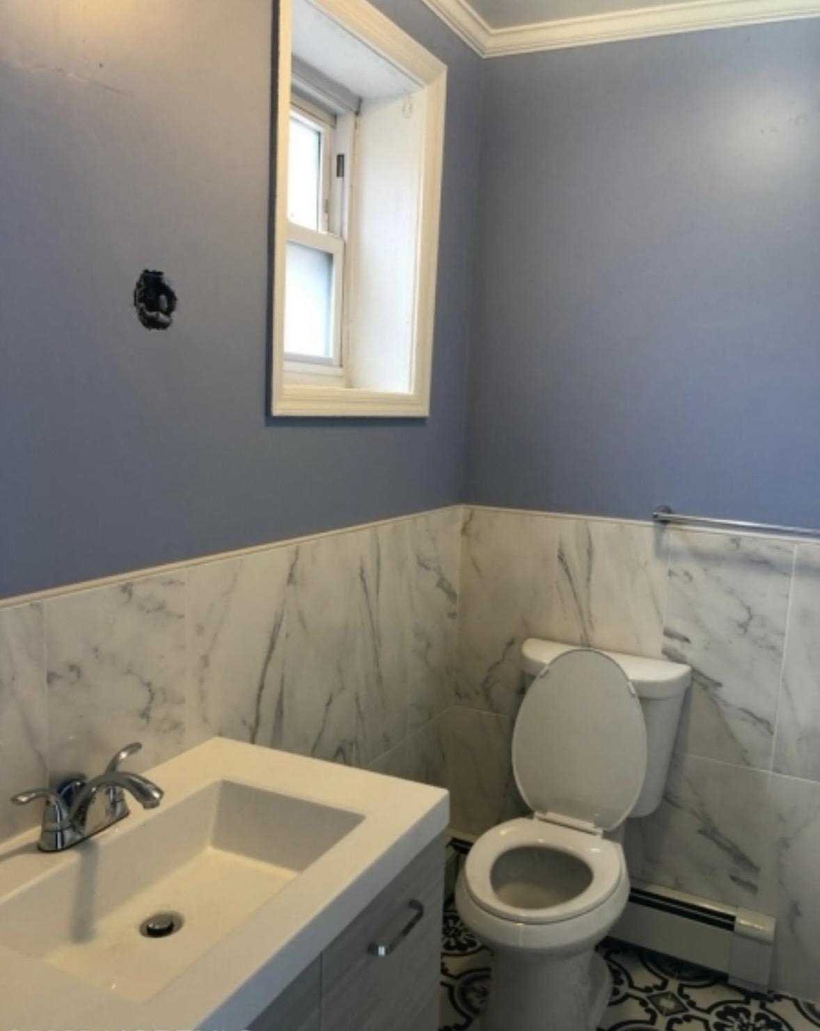 505 5th Street Union City, NJ 07087 - Photo 4 of 17 a bathroom with a sink and a toilet