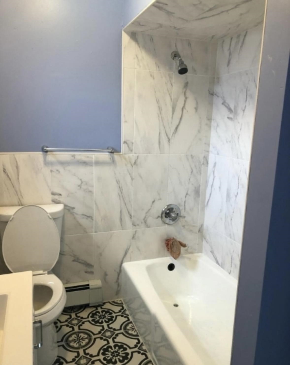 505 5th Street Union City, NJ 07087 - Photo 5 of 17 a bathroom with a bathtub and a toilet