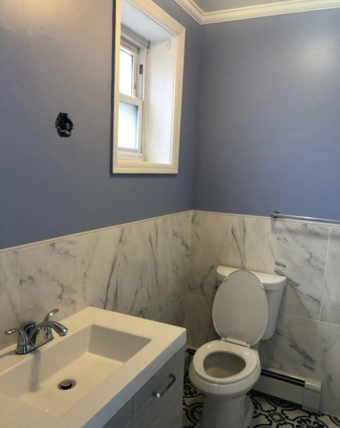 505 5th Street Union City, NJ 07087 - Photo 6 of 17 a bathroom with a sink and a toilet