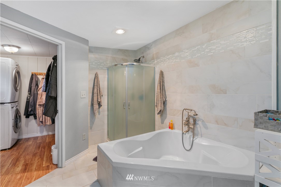 7232 191st Avenue Southwest Rochester, WA 98579 - Photo 23 of 40 a bathroom with a sink and a tub