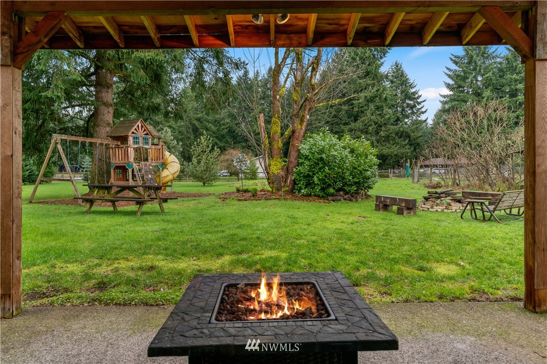 7232 191st Avenue Southwest Rochester, WA 98579 - Photo 28 of 40 a view of a backyard with sitting area