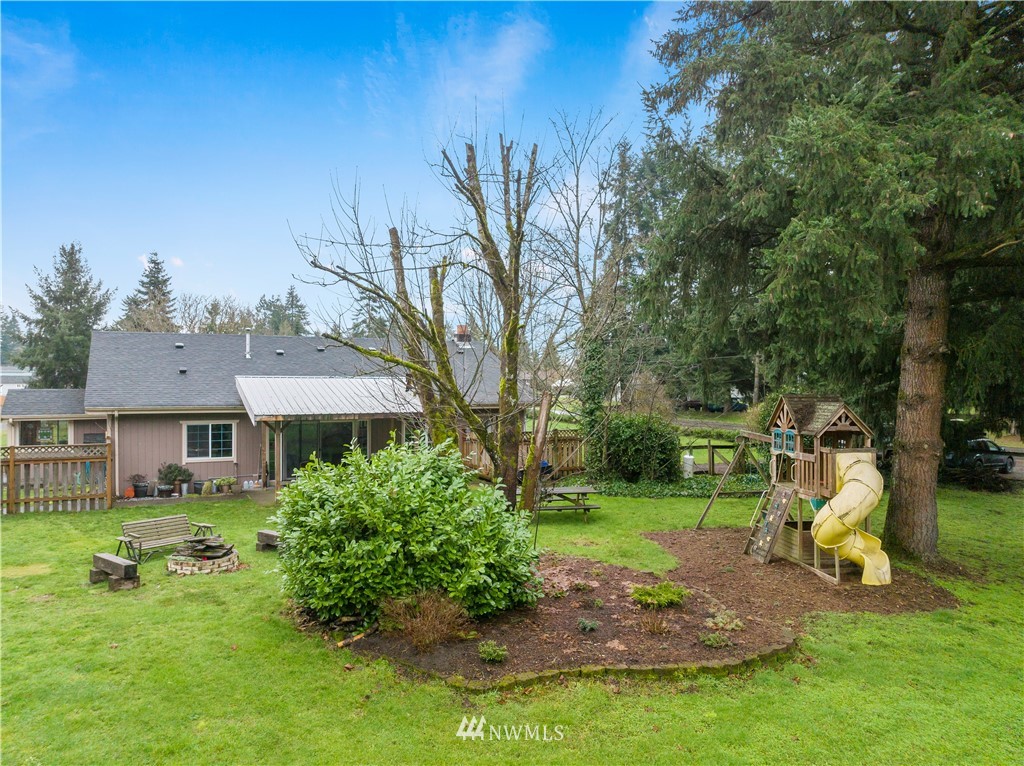 7232 191st Avenue Southwest Rochester, WA 98579 - Photo 30 of 40 a view of a house with a backyard