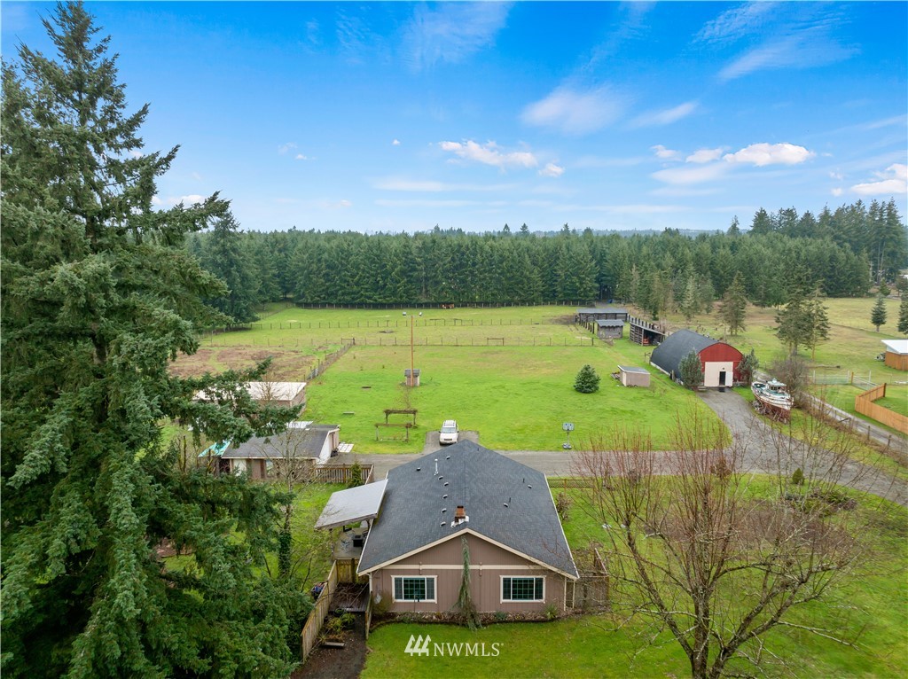 7232 191st Avenue Southwest Rochester, WA 98579 - Photo 4 of 40 a view of a lake with a yard