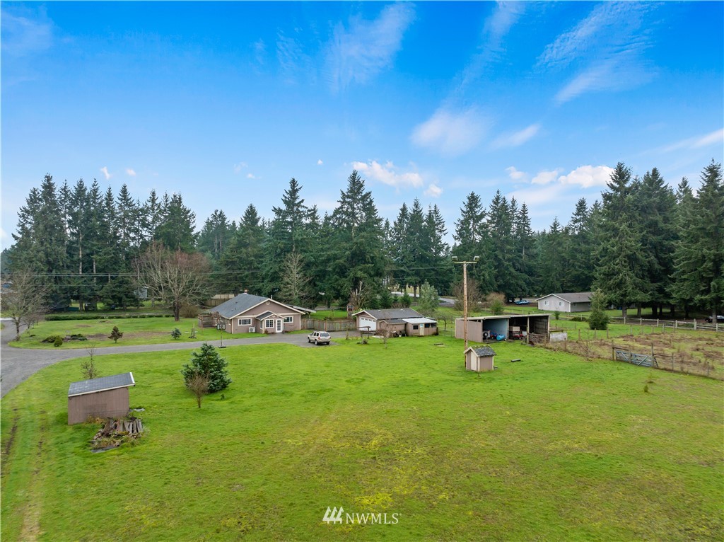 7232 191st Avenue Southwest Rochester, WA 98579 - Photo 6 of 40 a view of a house with a yard porch and sitting area